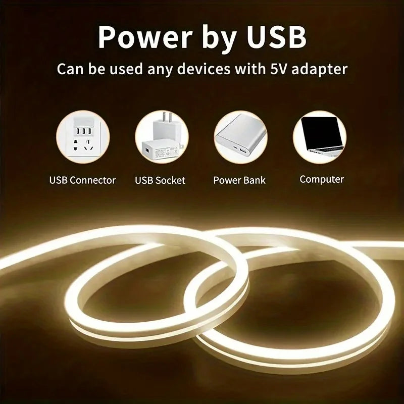LED strip light with text and icons indicating power by USB compatibility on a dark background.